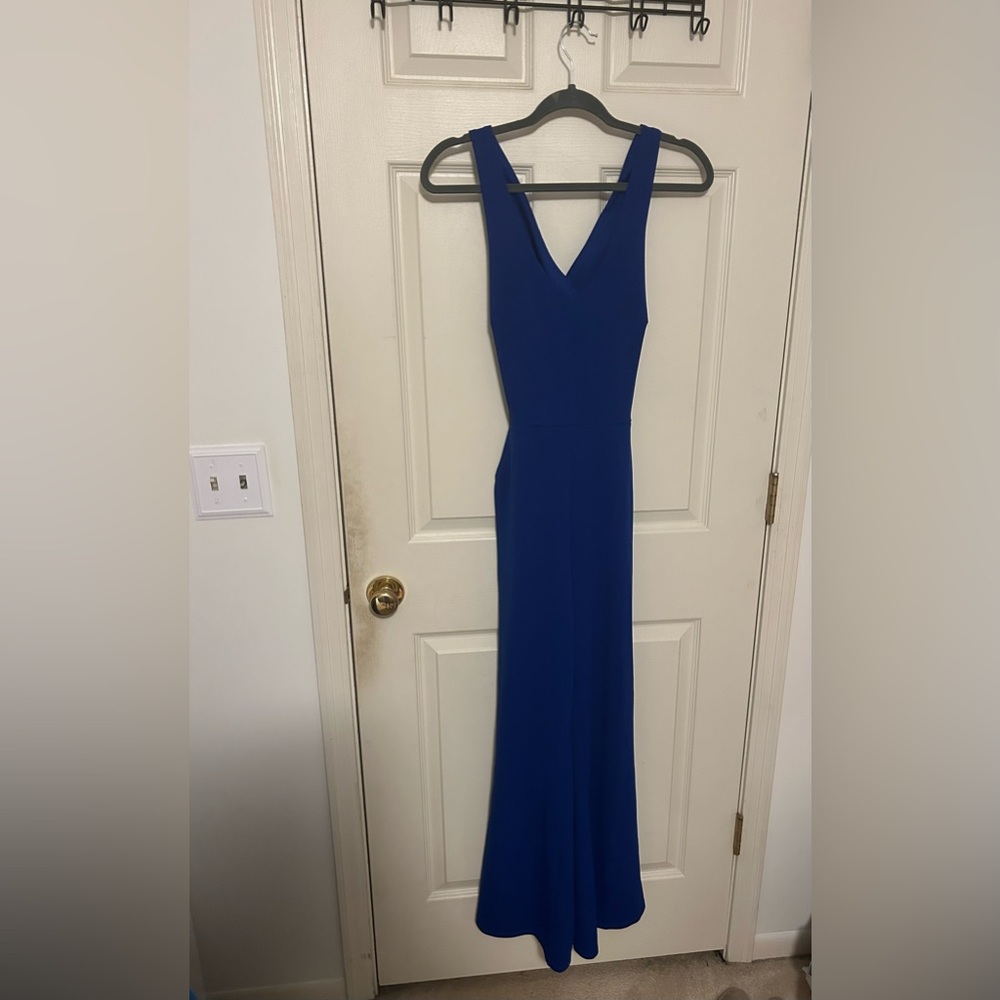 Size M Pant suit romper with pockets and open back